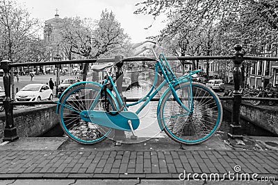 Lonely azure bike in Amsterdam Editorial Stock Photo