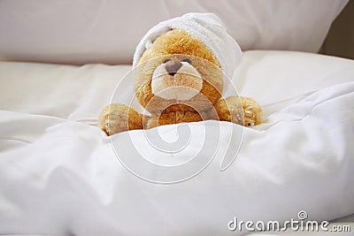 Lonely bear in bed Stock Photo