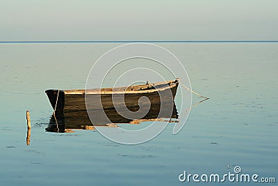 Lonely boat in the quiet sea Stock Photo