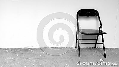 lonely chair photograph black white wall Stock Photo