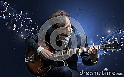 Lonely composer playing on guitar Stock Photo