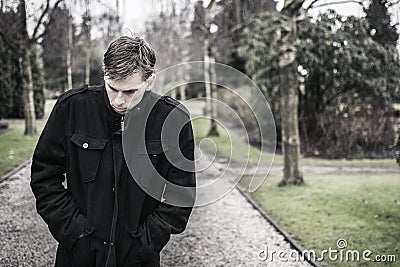 Lonely depressed man outdoors Stock Photo