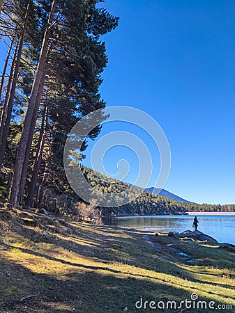 Lonely fisherman at Andorran lake Editorial Stock Photo