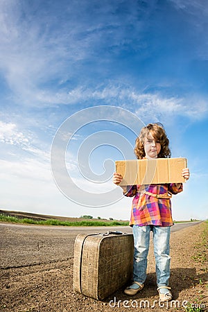 Lonely girl with suitcase Stock Photo