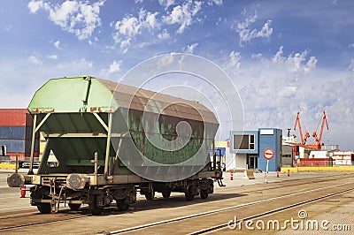 Lonely goods van on a railroad at container terminal in a marine port Stock Photo