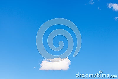 Lonely little cloud in blue sky Stock Photo