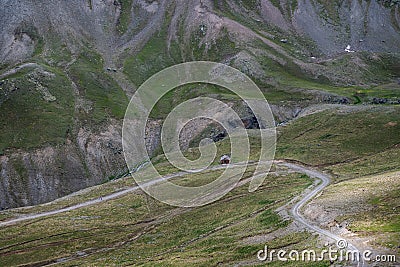 A lonely little house in the mountains. Mountain shelter for wanderers and travelers. Stock Photo