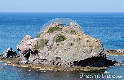 Lonely little island in the mediterranean sea Stock Photo