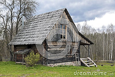 Lonely log cabin surrounded by rural landscape Stock Photo