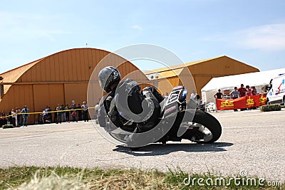 Lonely motorbike racer in the left turn on the track. Editorial Stock Photo