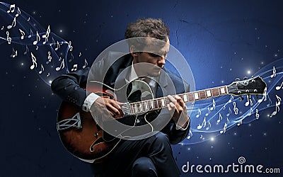 Lonely composer playing on guitar Stock Photo