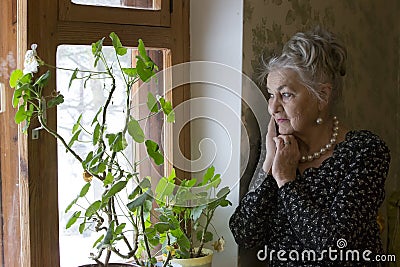 Lonely old woman Stock Photo