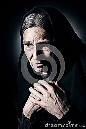 Lonely old woman in mourn and sorrow Stock Photo