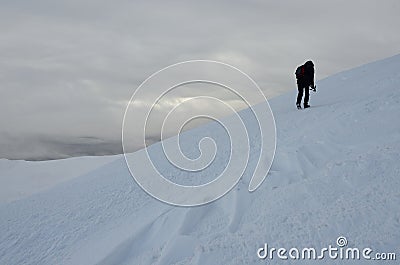 Lonely photographer with tripod making winter trekking,Ukraine Stock Photo