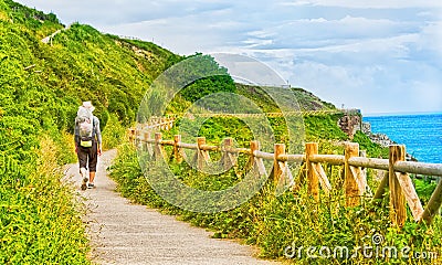 Lonely Pilgrim with backpack walking the Camino de Santiago in S Stock Photo