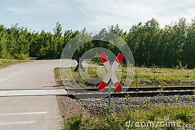 Lonely railroad crossing with stop sign Stock Photo