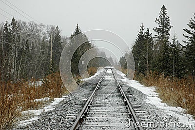 Lonely railroad tracks in snow Stock Photo