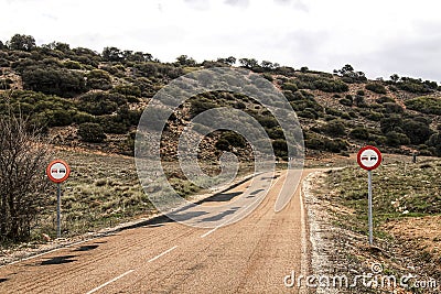 Lonely road with speed road sign Stock Photo