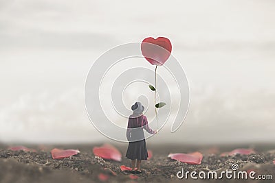 Lonely romantic woman holds a giant petal made to heart Stock Photo
