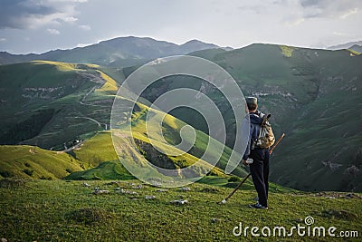A lonely shepherd on top of a green hill in Dagestan Stock Photo