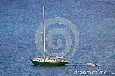 Lonely Sloop and its Dingy Stock Photo