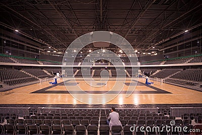 Lonely spectator in sports hall Stock Photo