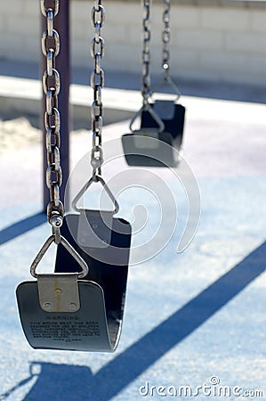 Lonely swings Stock Photo