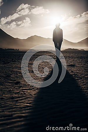 Lonely woman in desert Stock Photo