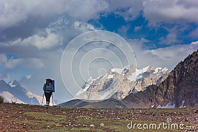 Lonely woman hiking in the mountains Stock Photo