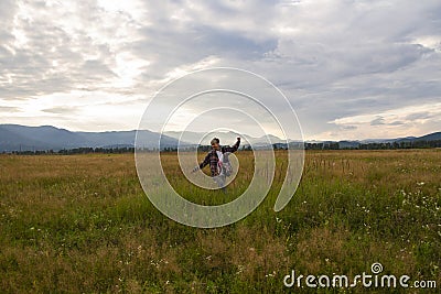 Lonely woman traveler in the highlands Stock Photo