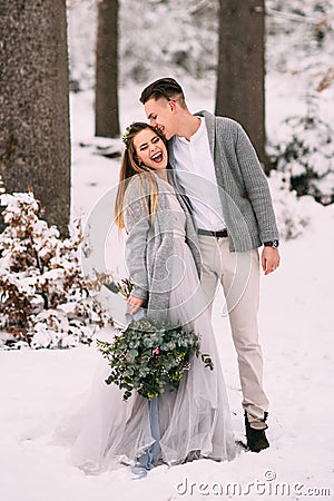 Young pretty pair of lovers. Winter. Date. A pair of lovers on a date in the mountains. Stock Photo