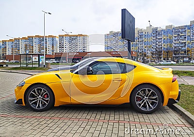 Big elegant modern yellow sport car Toyota Supra coupe left side view Editorial Stock Photo