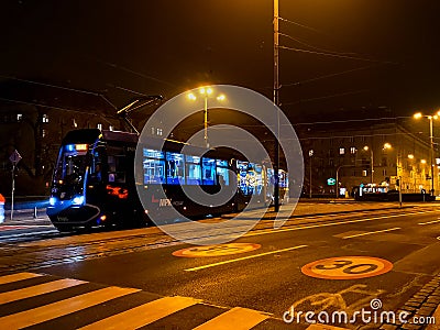 Long blue tram ride through the Kosciuszki square at night Editorial Stock Photo
