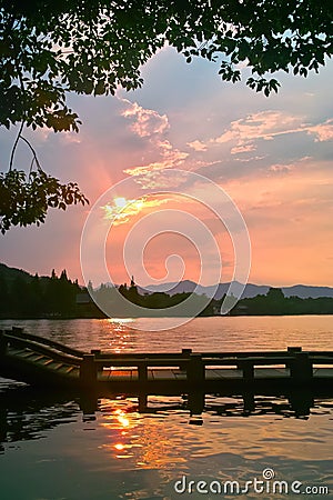 Long bridge by China West Lake at Sunset Stock Photo