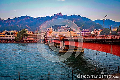 Long bridge over the Ganga river during morning time in Haridwar India Stock Photo