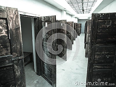 Long corridor with many doors to prison cells Stock Photo