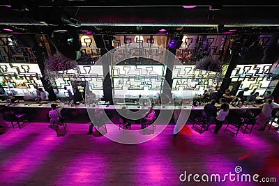 Long dance floor near bar with people Editorial Stock Photo