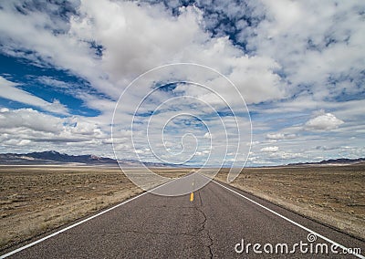 Long Desolate Road in the Desert Stock Photo