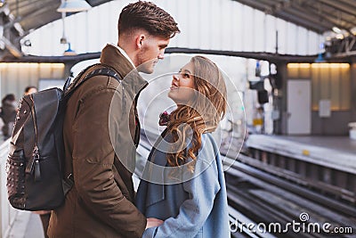 Long distance relationship, couple at the train station Stock Photo