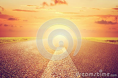 Long empty asphalt road towards sunset sun. Stock Photo