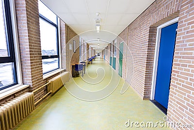 Long empty corridor in high school building Stock Photo