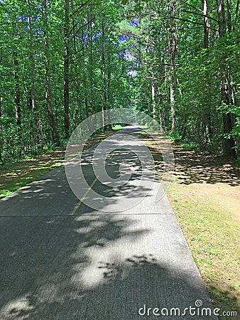 A long empty paved walking and biking path Stock Photo