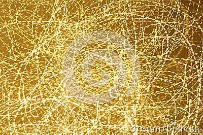 Long esposure speed of lights in golden color and various shape. Abstract festivebackground Stock Photo