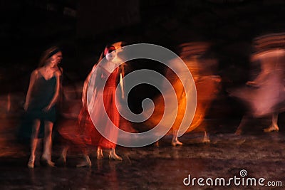 Long exposed and colorful photo of the ballerinas and ballets performing their art in a musical. Stock Photo