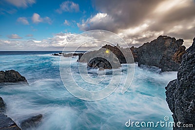 Long exposure of Biscoitos with volcanic rocks in Terceira Island Stock Photo