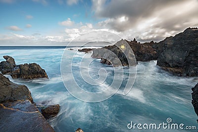 Long exposure of Biscoitos with volcanic rocks in Terceira Island Stock Photo