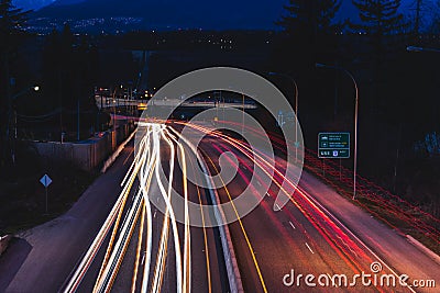 Long exposure of car lights on highway at night Stock Photo