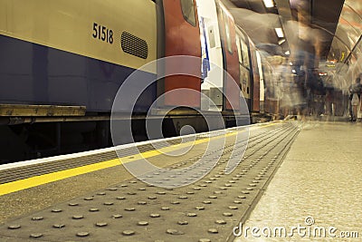 Long exposure commuters on London underground Stock Photo