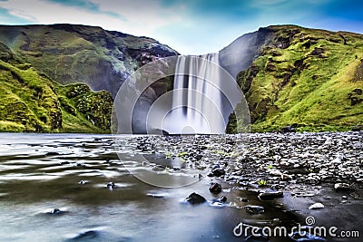 Long exposure of famous Skogafoss waterfall in Iceland at dusk Stock Photo