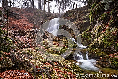 Long Exposure of Josefstaler Waterfall in Autumn Atmosphere in Bavaria, Germany Stock Photo